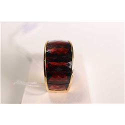 New old stock 18kt yellow gold and garnet gemstone ring. Set with cushion cut channel set garnet rin