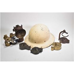 Selection of vintage mining lamps including two helmet lamps, table top burners, hanging lamps etc. 