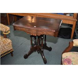 Antique Eastlake lamp table with carved skirt and center pedestal