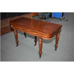 Early 19th century mahogany "D" shaped dining fold over table standing on four turned supports with 