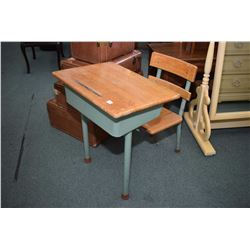 Two vintage student desks each with attached chair, one metal and wood and one all wood