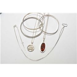 Tray lot of silver jewellery including Celtic pendant and chain, two chaised bangles marked sterling