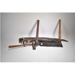 Selection of antique tools including two cedar shake splitter with mallet and three scythe blades