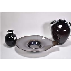 Three pieces of signed art glass including gun metal glass center bowl, two cased glass vases 6" and