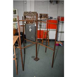 Selection of vintage laundry items including folding ironing board, a folding four sided drying rack
