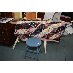 Antique folding wooden ironing board, an antique quilt, three iron trivets and a small painted stool