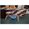 Image 1 : Antique folding wooden ironing board, an antique quilt, three iron trivets and a small painted stool