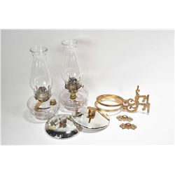 Pair of matching colourless oil lamps with brackets and reflectors
