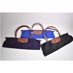 Three vintage Longchamp Le Pliage leather handled vinyl shopping bags