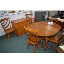 Vintage oak kitchen table with jack knife leaf and six spindle back chairs plus a oak credenza with 