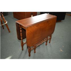 Antique walnut drop leaf gate-leg table with turned supports and legs