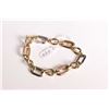 Image 1 : Lady's 18kt yellow and white gold linked chain bracelet 7 1/2" in length, marked 750