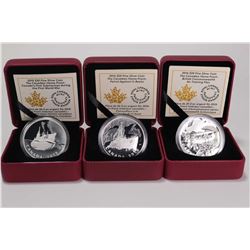 Three cased Royal Canadian Mint coins from The Canadian Home Front collection, all are $20 coins and