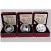Image 1 : Three cased Royal Canadian Mint coins from The Canadian Home Front collection, all are $20 coins and