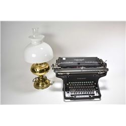 Vintage Underwood typewriter and brass oil lamp converted to electric with milk glass shade and hurr