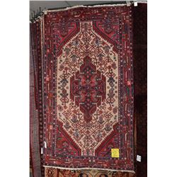 100% handmade Iranian Hamden area carpet with center medallion and highlights of red, cream, blue et