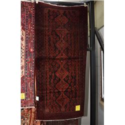 100% handmade Iranian Baluchi area carpet with multiple medallions and highlight of deep reds, black