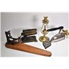 Image 1 : Antique Eagle fabric fluter, a gas powered iron, a wooden clamp on sleeve board, Royalty horse brass