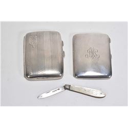 Two sterling silver cigarette cases with British hallmarks and a fruit knife with sterling blade and