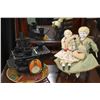 Image 1 : Two antique china head dolls including a 14" and a 10 1/2" on a cast and wooden rocking chair plus a