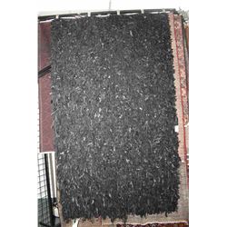 Interesting all black leather "shag" carpet 60" X 96"