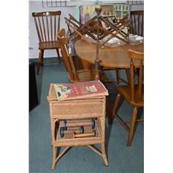 Floor standing wicker sewing box, scrap book of sewing samples, three wooden spools and a table moun