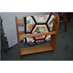 Oak quilt rack and a vintage hand pieced cotton quilt