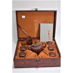 Wood cased set of purple clay teapot and six cups with collector's note