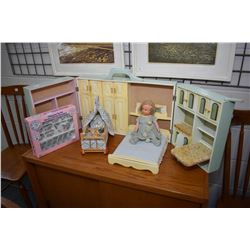 Child's wooden doll play set that opens to reveal a Murphy bed, fold down table with chair, storage 