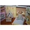 Image 2 : Child's wooden doll play set that opens to reveal a Murphy bed, fold down table with chair, storage 