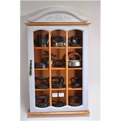 Wall mount display cabinet with selection of miniature irons, mostly vintage, a small adjustable wre