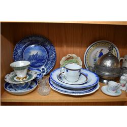 Shelf lot of collectibles including antique flow blue, cups and saucer, moustache cups, cheese keep,