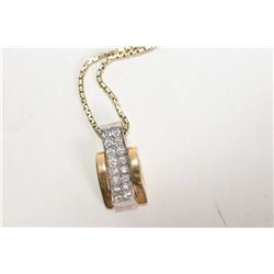 14kt yellow gold 18" box chain and a 10kt yellow and white gold pendant set with diamond like stones