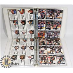 2 BINDERS OF ASSORTED HOCKEY CARDS.