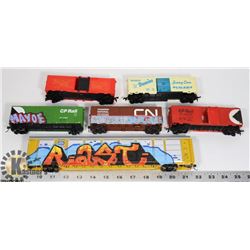 FLAT OF TOY TRAIN CARS.
