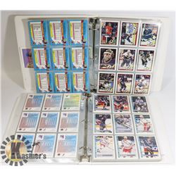 2 BINDERS OF ASSORTED HOCKEY CARDS.