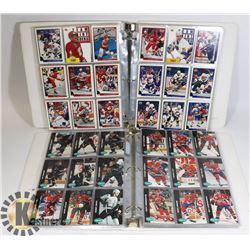 2 BINDERS OF ASSORTED HOCKEY CARDS.