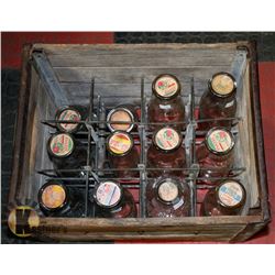 COLLECTION OF ANTIQUE MILK BOTTLES IN CRATE
