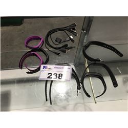 GROUP OF 5 FITBITS WITH CHARGING CABLES & EXTRA BANDS