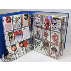 LOT OF 500+ HOCKEY CARDS IN BINDER.