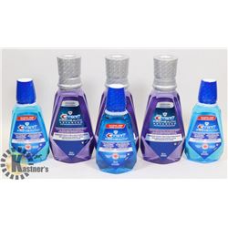 BAG OF ASSORTED CREST MOUTHWASH.