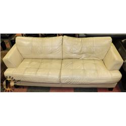 90" OFF WHITE LEATHERETTE SOFA-SHOWS SIGNS OF WEAR