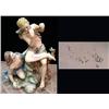 Image 1 : Porcelain sculpture of a boy and girl. 