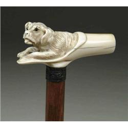 FINE CARVED IVORY DOG IN SHOE CANE