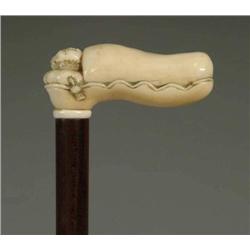 CARVED IVORY SLEEPING CHILD IN BED CANE