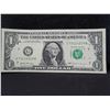 Image 1 : one dollar error bank note with a stack digit error.  The o in the serial number is raised higher th