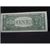 Image 3 : one dollar error bank note with a stack digit error.  The o in the serial number is raised higher th
