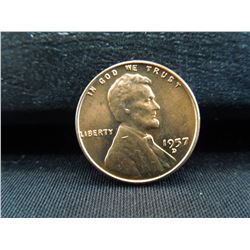 but 1957-d wheat cent with a die break from the wheat lines to the rim