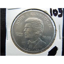 ten dollar coin from Liberia commemorating the life of john f Kennedy jr