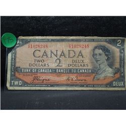 series of 1954 two dollar canadian bank note with the devil's face.  This was an error in printing. 